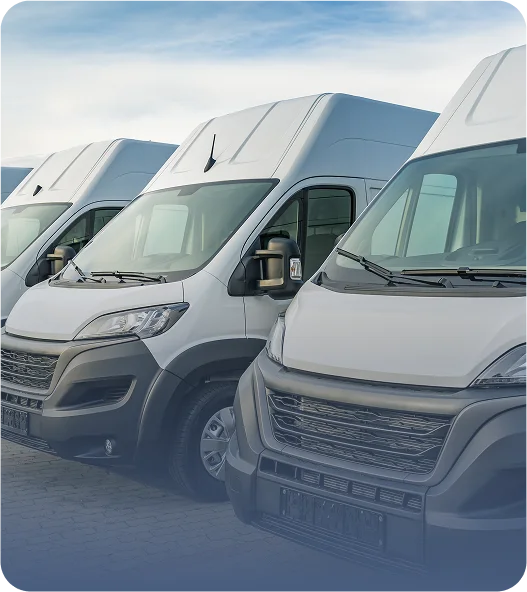 Fleet of white commercial vans parked for JVRC field inspections, reliable transportation supporting risk assessments and audits