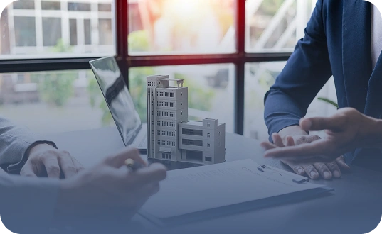 Business owners reviewing property plans highlighting commercial property insurance services in California